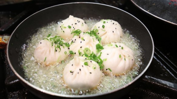 Most tables order snacky dishes like pan-fried pork buns.