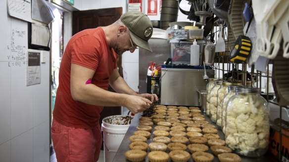 Flour Drum bakery co-owner Johnny Ageletos prepares his fruit mince pies in Newtown.