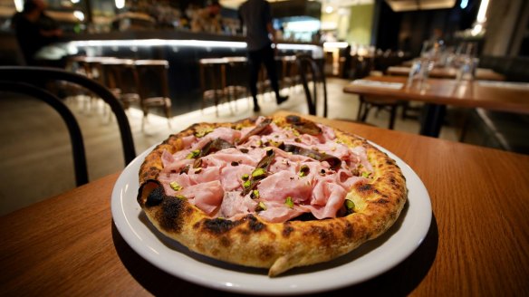 Mortadella pizza with taleggio and pistachio.