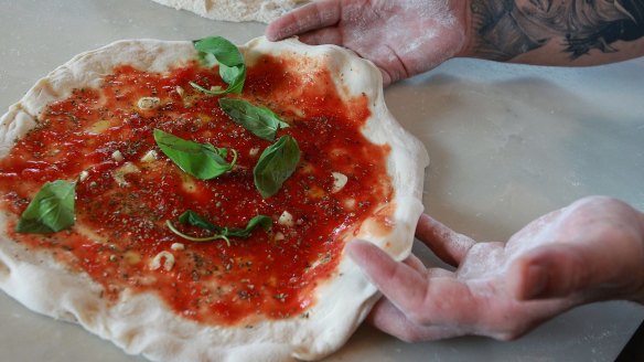 Chef Marco Graziani prepares pizza at Tartufo restaurant in Brisbane.