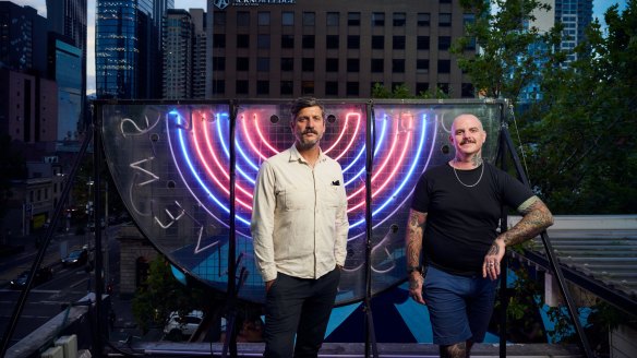 Fancy Hank's co-owners Kent Bell (left) and Mike Patrick on the site of their soon-to-be expanded rooftop bar Good Heavens.