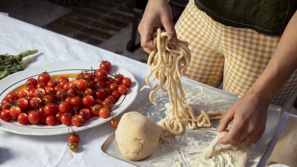 Michaela Johansson with local tomatoes and pici - a type of chunk spaghetti.
