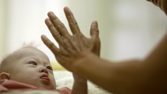 Baby Gammy plays in hospital in Thailand.
