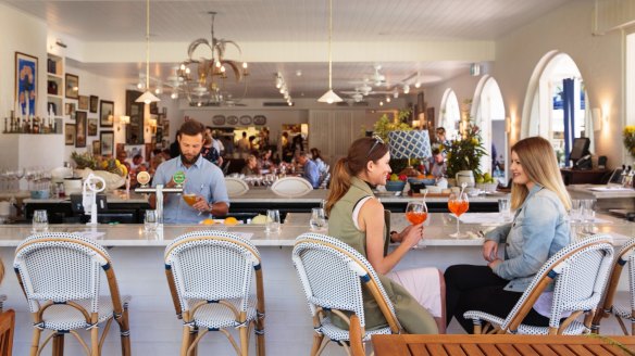 The "beachy blue-and-white detailed comfort" of the restaurant.