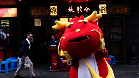 A fiery mascot at the north end of Dixon Street.