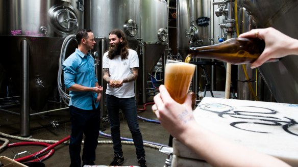 Solar energy specialist Jake Steele and Oscar McMahon, co-owner and brewer from Young Henrys, which has a rooftop solar farm.