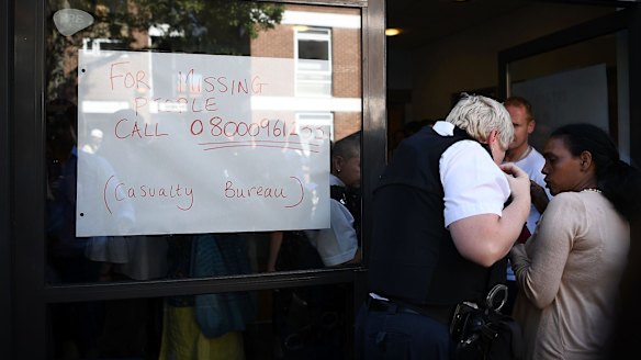 A missing persons number is displayed in the window of a casualty bureau.