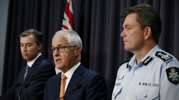 Michael Keenan, Malcolm Turnbull and AFP Commissioner Andrew Colvin address the media.