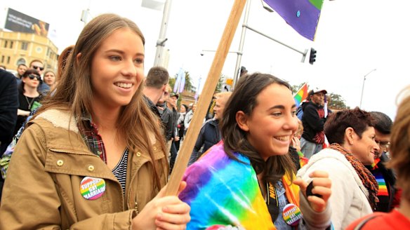Jessica Feyder (left) and Samantha Ritchie lobby for marriage equality at a rally in Taylor Square, Darlinghurst, on Sunday.