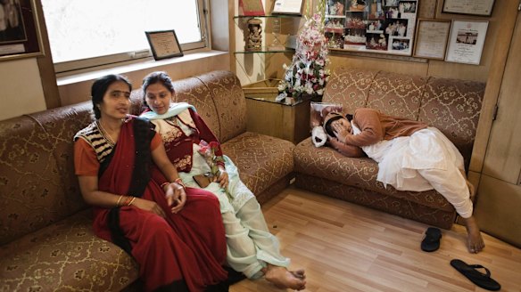Surrogates Neelam Jaisawal (centre) and Neelam Chauhum (right) wait for a check-up at the Delhi Fertility and Research Centre in New Delhi in 2009.