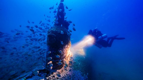 Deep blue: Maritime archaeologist Matt Carter diving on the wreck of the Japanese midget submarine off Bungan Head.