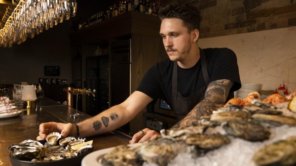 Head chef Nick Mathieson arranging a plate of oysters at The Rover in Surry Hills.