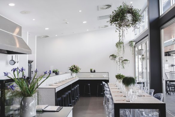 The glamourous fit-out is predominantly white, draped with plants, and with pops of colour from quirky vintage-style plates and glasses, and rose gold cutlery. 