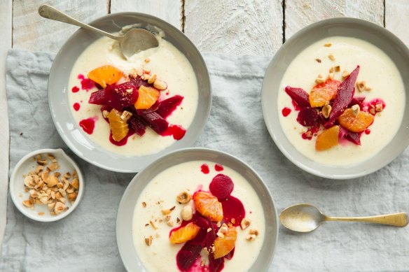 A dessert to celebrate spring, this lemon panna cotta recipe is served with  poached rhubarb, beetroot and hazelnuts.