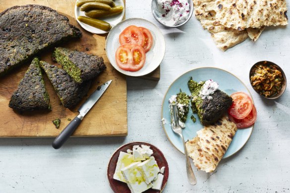 Kuku sabzi, or Persian herb frittata, served with crunchy and acidic condiments.