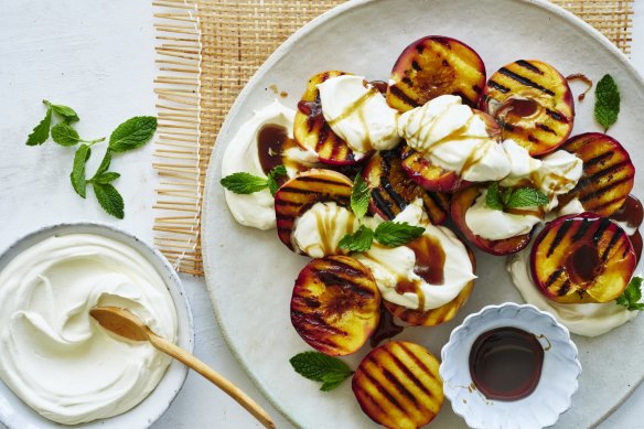 Grilled peaches with coconut yoghurt and brown sugar.