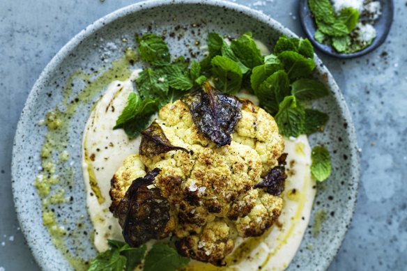 Whole roasted cauliflower with hummus and honey.