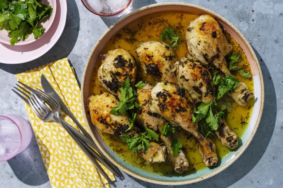 Slow-roasted chicken drumsticks with butter and sage.
