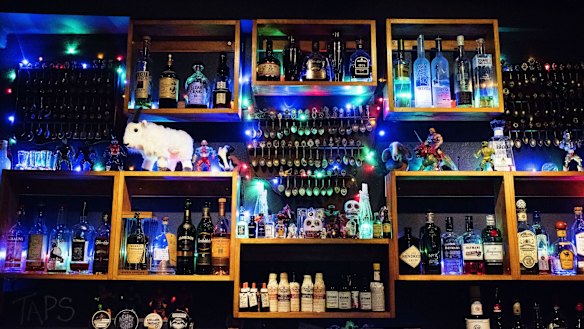Display cases add to the bar's eclectic and friendly vibe.