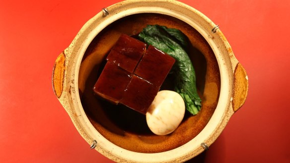Belly pork slow-cooked in master stock and served with a soft-yolked tea egg.