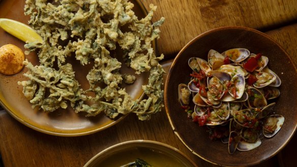 Crunchy saltbush with smoked chilli and bush tomato sauce (left), and South Ballina pipis with house-made XO butter.