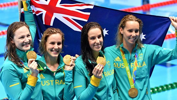 Golden girls: Australia's 4x100m freestyle relay team celebrate with their medals.