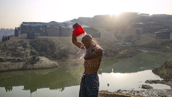 Mohamad Hossain takes a bath in Kutapalong Rohingya refugee camp.