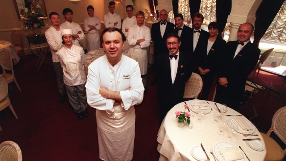 Philippe Mouchel surrounded by staff as they prepare for Bocuse restaurant's closure.