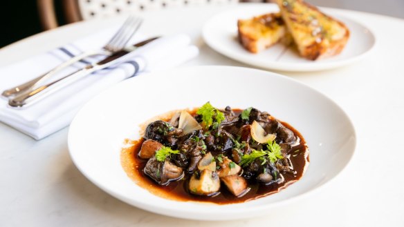 Snail meurette - snails in red wine and bacon sauce.