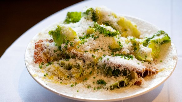 Caesar salad is tossed and dressed tableside, just as it was designed to be.