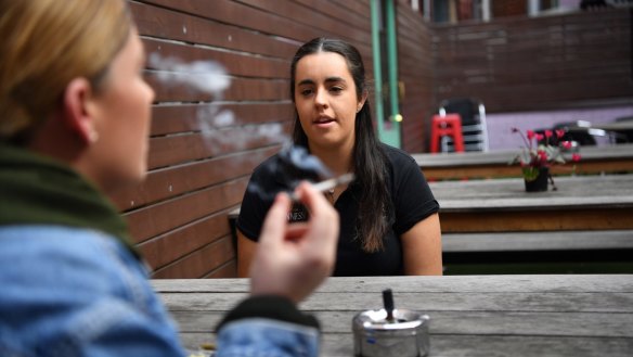 Bryony Fitzgerald, manager of the Last Jar, with a smoker in the beer garden.