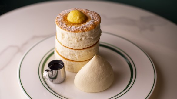 Gram's souffle pancakes with butter, cream and maple syrup.