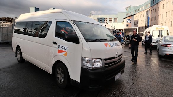 A bus with contract workers leaves Carlton and United Breweries on Tuesday.