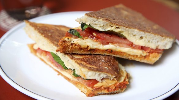 Pressed focaccia with 'nduja, smoked mozzarella, tomato and basil.