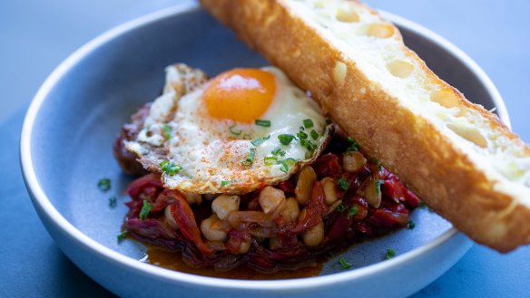 Parsley and pecorino sausages from LP's Quality Meats, with fried egg and chickpea peperonata.