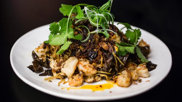 Stir-fry prawn, bug tail, egg noodle, garlic chive and hellfire chilli oil.