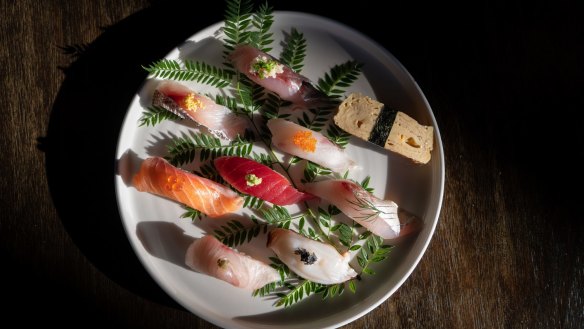 A platter of beautifully burly sushi is delicately daubed with fish eggs, seaweed, pickled ginger and wasabi.