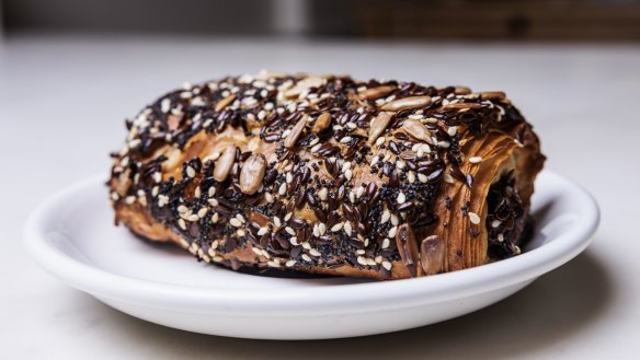 Mandu pastry reconstructed as a fancy, seed-encrusted sausage roll.