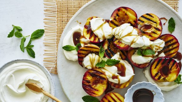 Grilled peaches with coconut yoghurt and brown sugar.