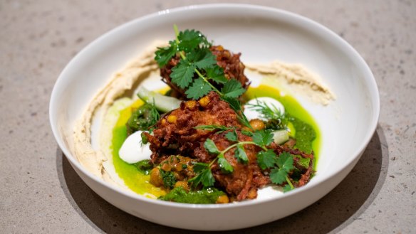 Carrot and onion fritters with whipped tahini, chickpea and zhoug.