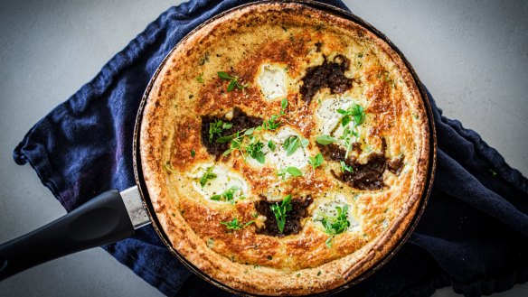 Dutch baby pancake dolloped with onion jam and goat's cheese (recipe below).