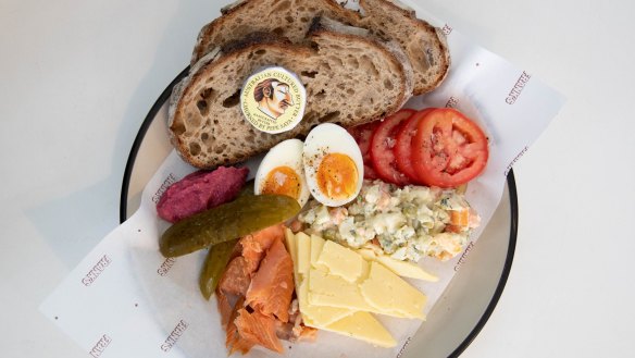 The Polish ploughman's plate includes ham, Kielbasa or house-cured salmon, pickle, egg, relish, vegetable salad and tomato.