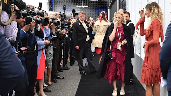 Paris Jackson, right, model daughter of the late Michael Jackson, poses for photographers before the running of the Melbourne Cup at Flemington Racecourse in Melbourne, Australia, Tuesday, Nov. 7, 2017. (AP Photo/Andy Brownbill)