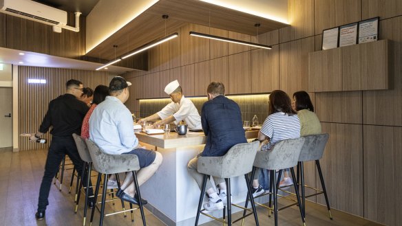 Chef Jang-Yong "Yong" Hyun behind the counter of his omakase restaurant, Sushi On.