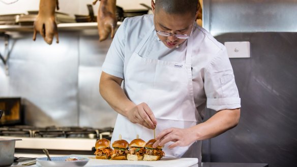 Merivale chef Dan Hong assembling his duck rilletes-filled buns. 