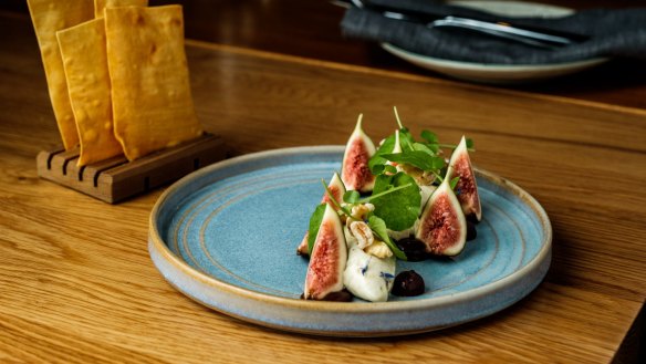 Lavosh squares with gorgonzola mousse and fresh fig, watercress and walnuts.