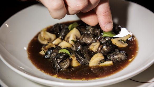 Chef Thomas Boisselier prepares snails in a red wine and bacon sauce at Manon Brassiere.