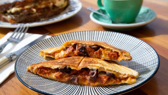 Tasty cheese jaffles contain sliced black olives and sujuk (fermented Levantine sausage). 