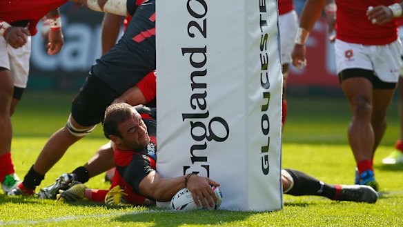Georgia captain Mamuka Gorgodze scores his team's first try against Argentina.