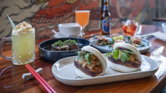 Bao with marinated pork, kimchi, Davidson plum, Sriracha mayo and Vietnamese mint.